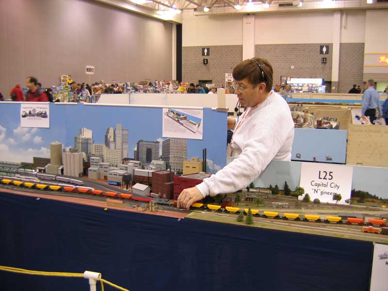 Marc adjusting a train on his module